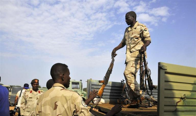 Sudanese soldiers collect weapons voluntarily surrendered by residents in South Darfur State, Sudan, on Sept. 23, 2017 (Xinhua photo)