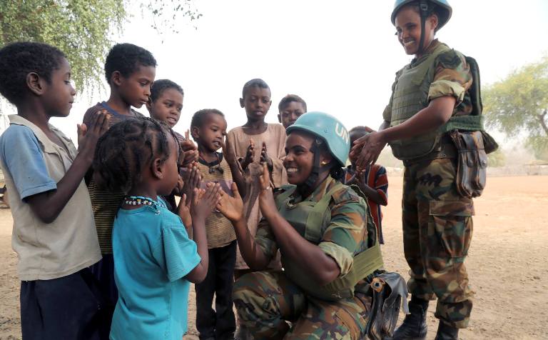 UNISFA peacekeepers play with Misseriya children in Abyei on 6 March 2019 (UINISFA photo)