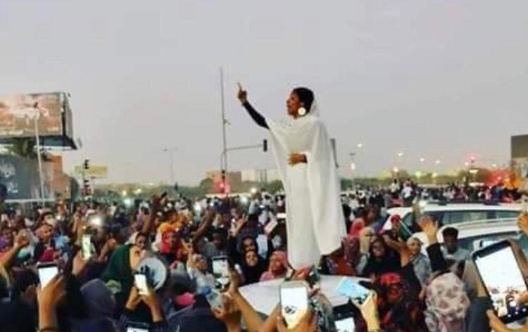 A female activist speaks to the protesters gathered outside the army headquarters in Khartoum on 9 April 2019 (ST Photo)