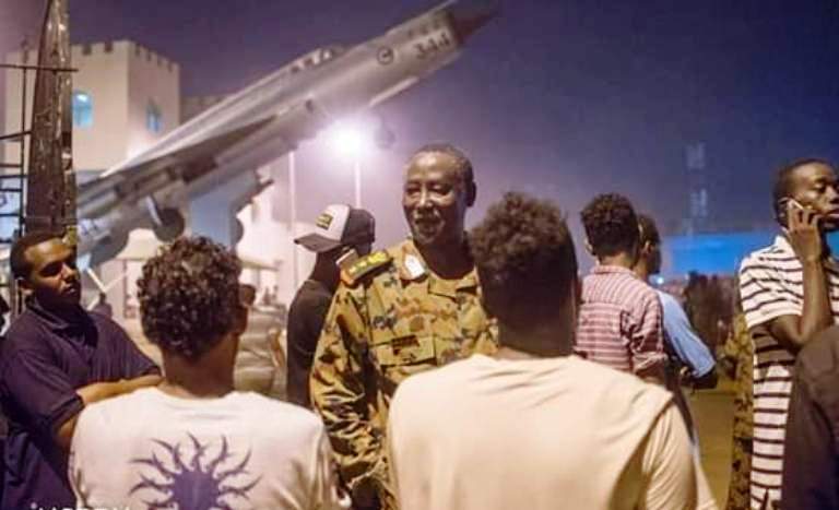 A Sudanese army colonel talks to protesters outside the army headquarters on 9 April 2019 (ST Photo)