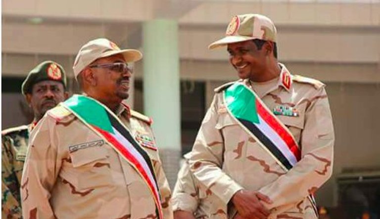 RSF's Mohamed Hamdan Daglo (aka Hemitte) with the unseated President Omer al-Bashir (file ST photo)
