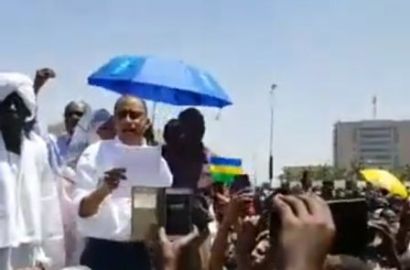 Omer al-Digair FFC leading member and SCOP leader reads an opposition joint statement outside the army headquarters on 8 April 2019 (ST Photo)