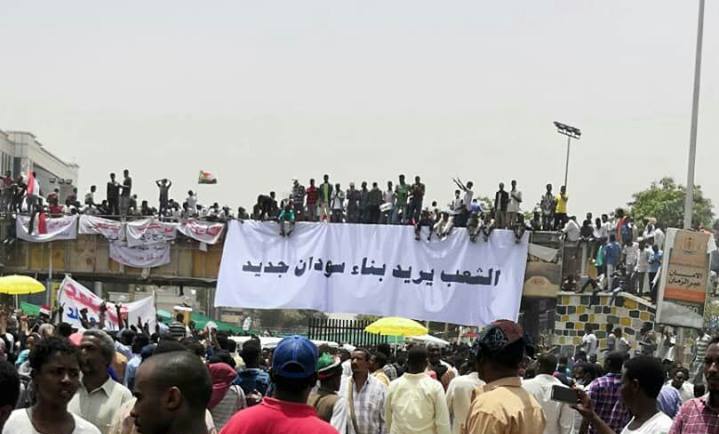The people want to build a new Sudan reads a banner held by protesters outside the army headquarters on Thursday 11 April 2019 (ST Photo)
