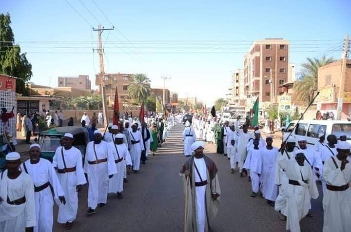 Sudanese Sufi Muslim devotees march in Khartoum streets in support of the protest movement against al-Bashir on 9 April 2019 (ST Photo)