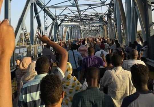 Sudanese cross a bridge in Khartoum heading to the army headquarters on 8 April 2019 (ST photo)