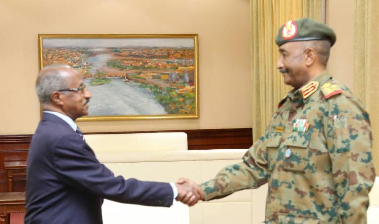 Head of Sudan's TMC Abdel Fattah al-Burha, receives Eritrea's FM Osman Saleh on 19 May 2019 (Suna Photo).jpg