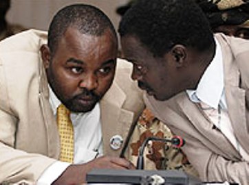 A file photo showing Abdel Wahid Al-Nur (L) and Minni Minnawi, during a round of peace negotiations in Abuja, Nigeria on May 1, 2006