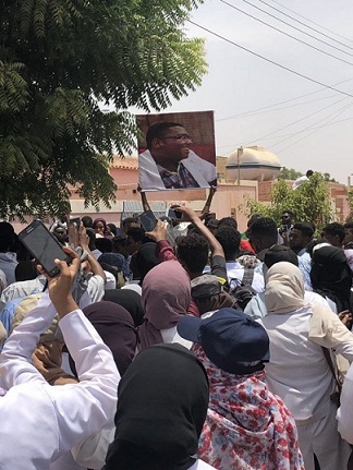 Demonstrators hold picture of a student killing during the protests on 13 July 2019 (ST photo)