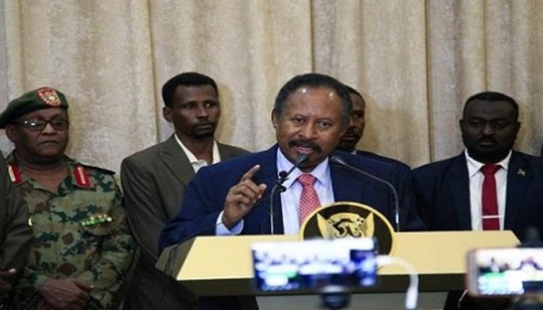 Sudan's Prime Minister Abdallah Hamdok speaks to the media after the swearing-in ceremony on 21 August 2019 (AFP Photo)