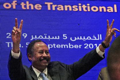 sudanese_prime_minister_abdalla_hamdok_flashes_victory_signs_as_he_unveils_his_first_cabinet_in_khartoum_on_5_september_afp_.jpg