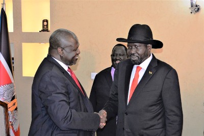 South opposition leader Riek Machar (L) greets President Salva Kiir in Juba on Saturday, Oct. 19, 2019 (PPU)