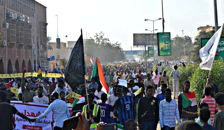 Demonstrators mach in Khartoum streets to commemorate the 55 anniversary of October revolution and call for reforms on 21 Oct 2019 (KAPO Photo)
