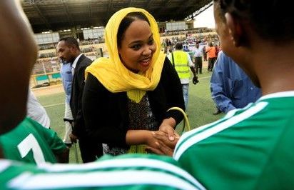 Sudan's sport minister Wala'a Essam al-Boushi greets females players on Monday 30 Sept 2019 (Reuters Photo)