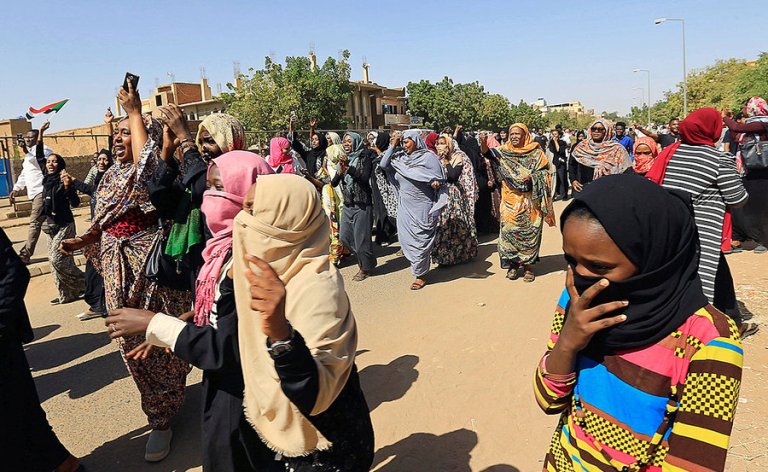 A group of Sudanese women chant slogans near the home of a demonstrator who died during anti-government in February 2019 (Reuters photo)