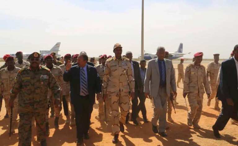 W. Darfur governor Abdel Khaliq Badawi (L) welcomes Hamdok, Hemetti, and Ahmed al-Gadi at Nyala Airport on 1 January 2020 (Sovereign Council photo)
