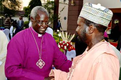 South Sudan's President Salva Kiir shares a light moment with Archbishop Daniel Deng Bol, December 31, 2019 (PPU)