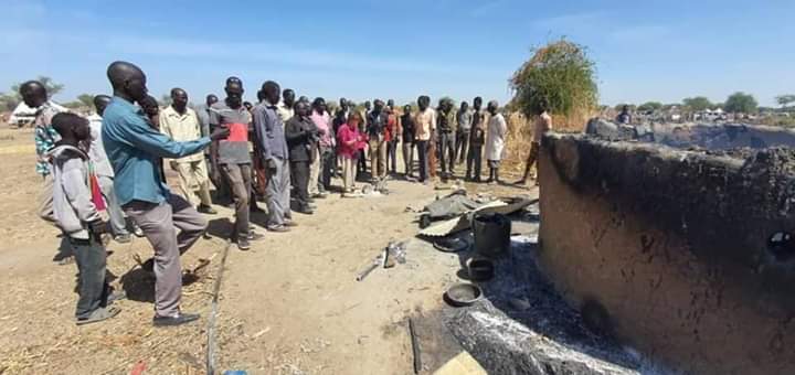 People gather around a house burnt by Misseriya gunmen in Komol of Abyei area on 22 January 2020 (ST photo)