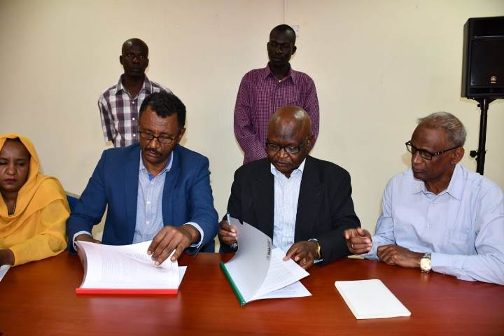 Amar Amum (R) and Farouq Salman sign a joint political declarationon in support of a secular state in Sudan on 25 Feb 2020 (ST photo)