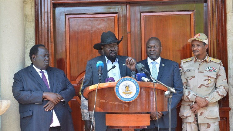 President Kiir talks to the media flanked by Riek Machar on Thursday 20 Feb 2020 (Photo SSPPU)