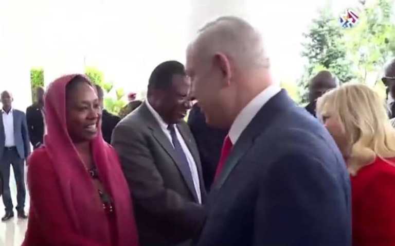 Israeli PM Netanyahu shakes hands with the only Sudanese diplomat who accompanied al-Burhan to Uganda on 3 February 2020 (ST photo)