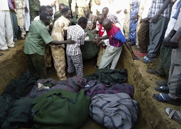 people_carry_the_bodies_of_plane_victims_into_a_group_grave_at_around_talodi_in_the_border_state_of_south_kordofan_19_august_2012._reu.jpg
