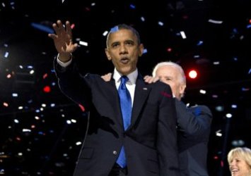 president_barack_obama_and_vice_president_joe_biden_celebrate_on_stage_at_the_election_night_party_at_mccormick_place_wednesday_nov._7_2012_in_chicago._ap.jpg