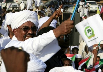 president_omar_al-bashir_is_greeted_by_crowds_outside_khartoum_airport_on_september_28_2012_upon_his_return_from_addis_ababa_after_the_signing_of_getty.jpg