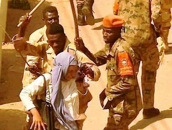 Central Reserve Forces beat a Sudanese female proteters in Khartoum