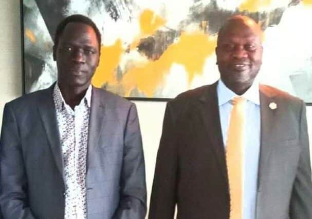James Dak poses with Dr Riek Machar