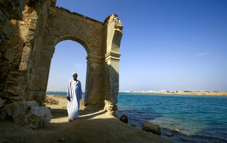 A Sudanese man stands at an archaeological site in Suakin Island on the Red Sea (AFP)