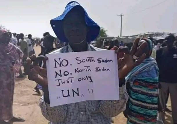 A youth protestor holds a placard on the disputed region, September 11, 2022 (ST photo)