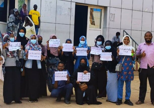 Doctors hold banners at Omdurman Hospital on September 6, 2022