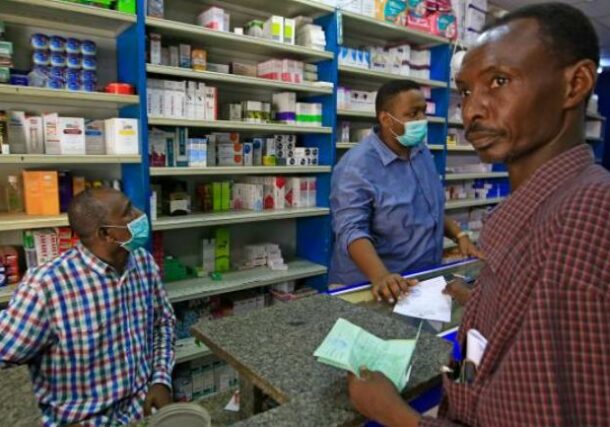 A customer buys medication at a pharmacy in Khartoum GettyImages