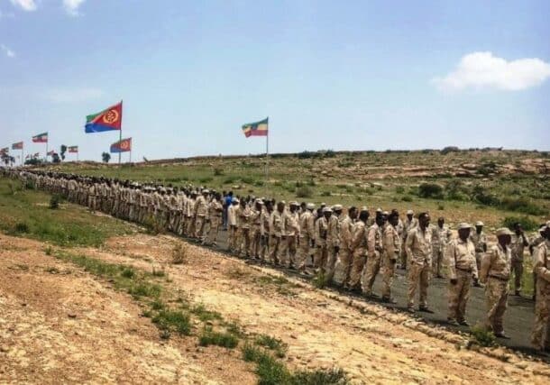 Eritrean soldiers wait in line to cross the border to attend a reopening ceremony with Ethiopia in Serha, Eritrea, on Sept. 11, 2018