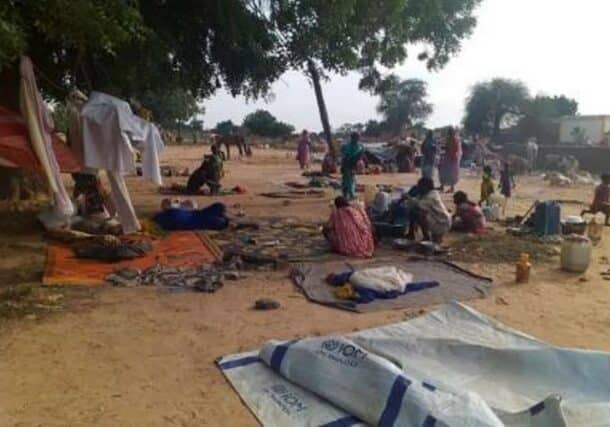 Villagers displaced by a surge of attacks squat on blankets and in hastily made tents in the village of Masteri in west Darfur, Ap phot