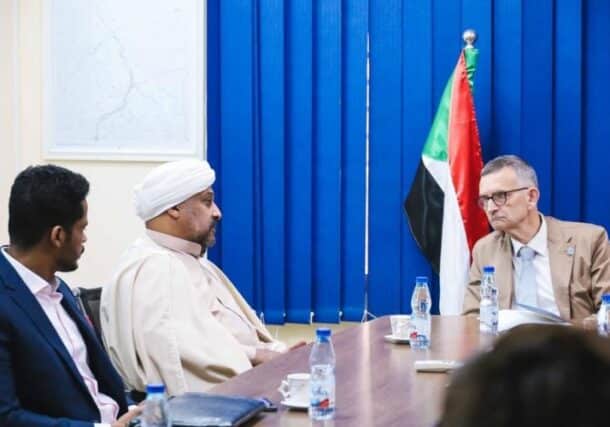Alhassan al-Mirgahni flanked by Ibrahim speaks with Volker Perthes in a meeting with the trilateral mechanism on Nov 1, 2022.