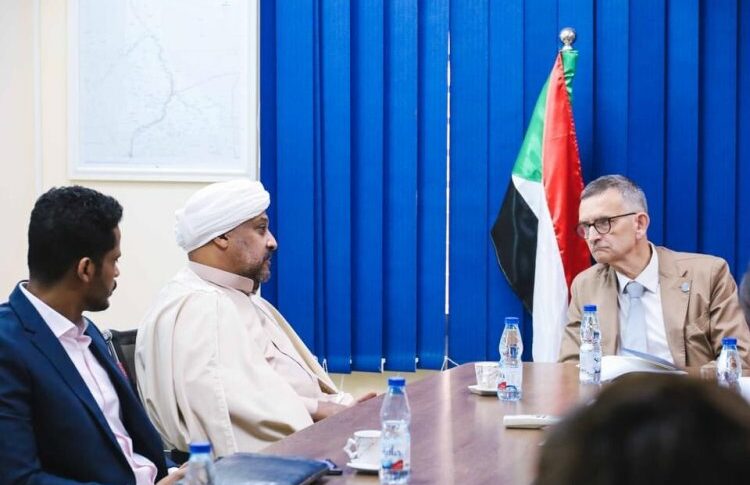 Alhassan al-Mirgahni flanked by Ibrahim speaks with Volker Perthes in a meeting with the trilateral mechanism on Nov 1, 2022.