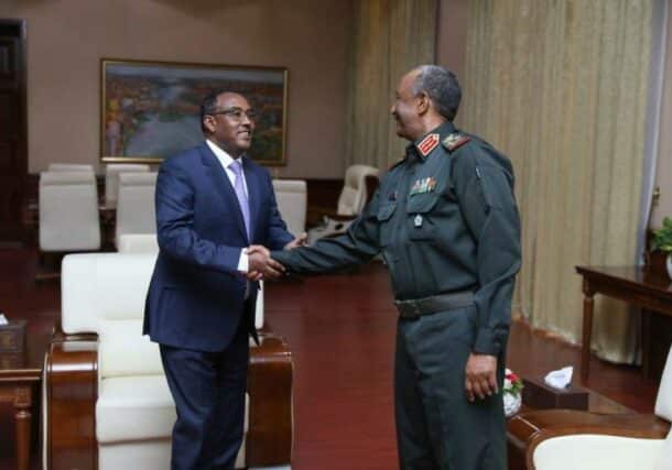 General al-Burhan shake hands with Ethiopian FM Mekonnen on December 1, 2022
