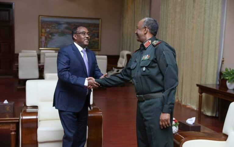 General al-Burhan shake hands with Ethiopian FM Mekonnen on December 1, 2022