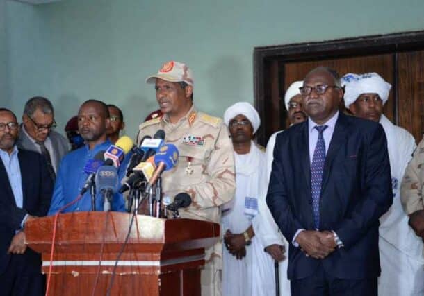 Hemetti speaks to the media in Nyala flaked by Hadi Idris and the the state officials on December 29, 2022