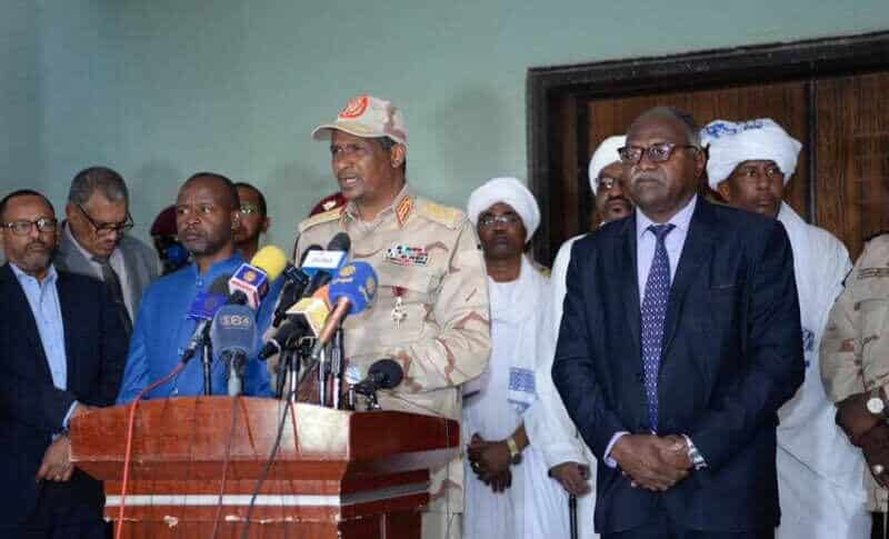 Hemetti speaks to the media in Nyala flaked by Hadi Idris and the the state officials on December 29, 2022
