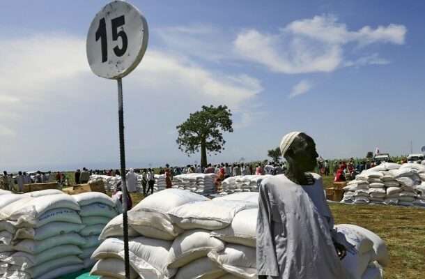 A man waits to receive food provided by the WFP during a visit by a EU delegation, at an IDP camp in Azaza, east of Ad Damazin, Blue Nile state, October 21, 2015. Reuters