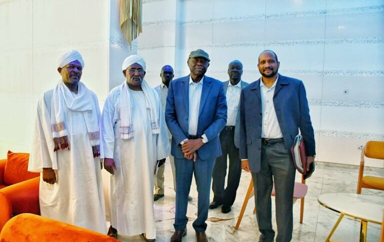 Al-Hilu (2d L) poses with the NUP leaders in Juba