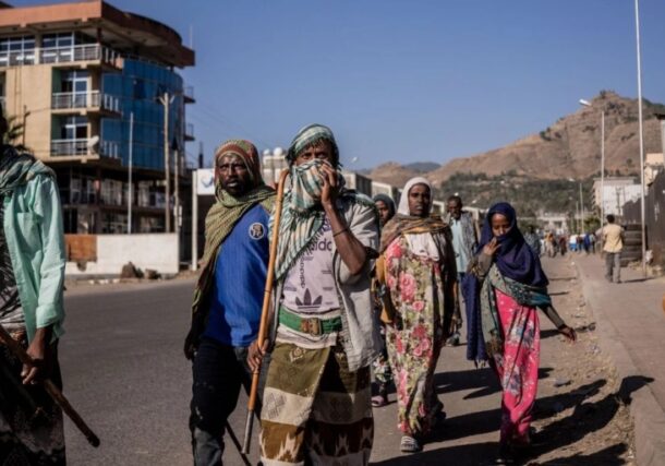 People walk in the streets in Kombolcha, Ethiopia, on December 11, 2021. AFP photo