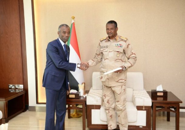 Sudan's Deputy Head fthe Sovereign Council Hemetti shakes hand with the Chadan envoy Idriss Boy on January 21, 2023