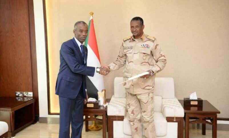 Sudan's Deputy Head fthe Sovereign Council Hemetti shakes hand with the Chadan envoy Idriss Boy on January 21, 2023