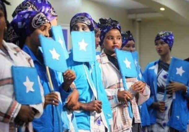 Women hold Somali flags at a Women's Peace Forum in Mogadishu, November 2018 UNDP photo
