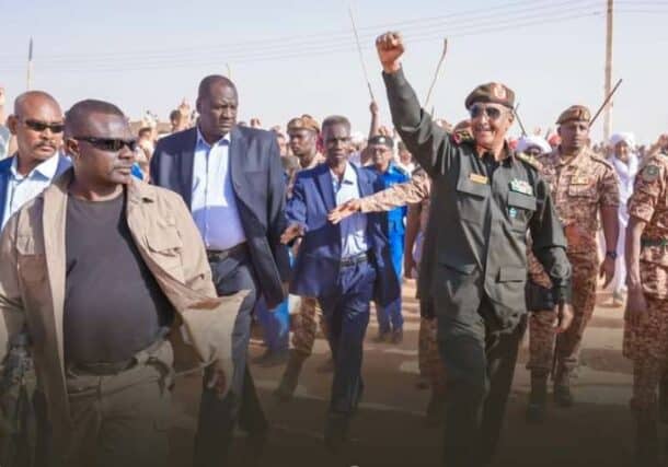 Al-Burhan salutes the crowd at his arrival in Zakiab of the River Nile state on February 16, 2023