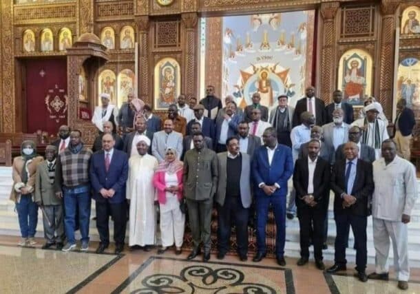 Signatories of the National Document Governing the Transitional Period pose after the end of their workshop in Cairo on February 7, 2023