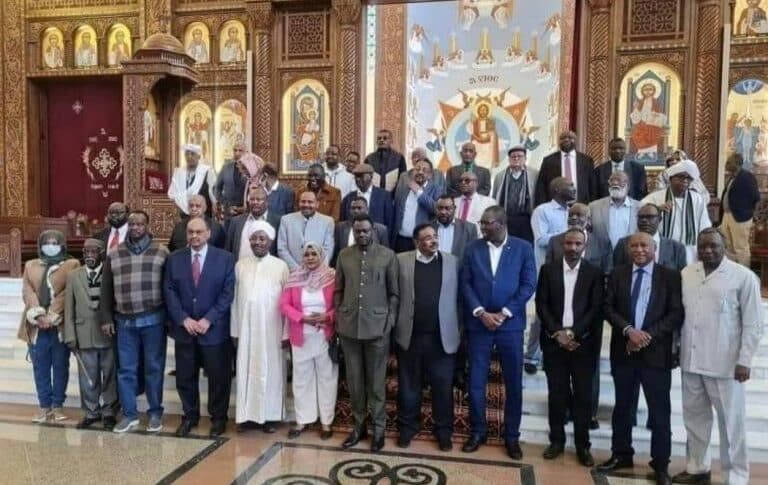 Signatories of the National Document Governing the Transitional Period pose after the end of their workshop in Cairo on February 7, 2023